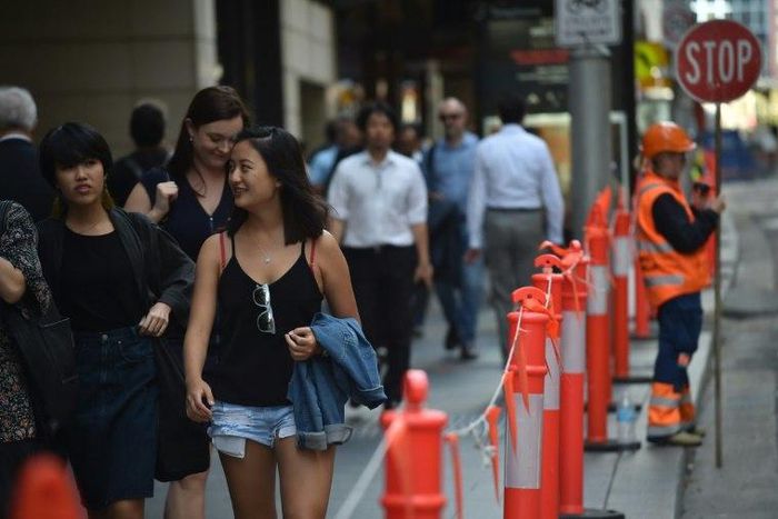 Pedestrians in Sydney's central business district on April 19, 2017. Australia's decision to scrap a visa programme for temporary foreign workers won both praise and criticism