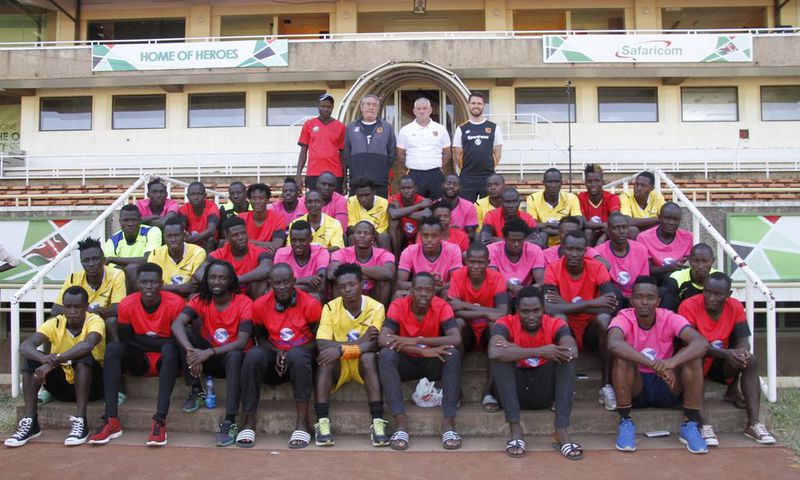 The players who went through the first phase of the camp pose with Harambee Stars Head Coach Stanley Okumbi, Development Coach Terry Boyle, Hull City legend Dean Windass, and Partnerships Executive Andrew Stead.