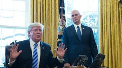 US President Donald Trump, with Vice President Mike Pence (R) speaks from the Oval Office of the White House in Washington, DC, on March 24, 2017