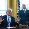 US President Donald Trump, with Vice President Mike Pence (R) speaks from the Oval Office of the White House in Washington, DC, on March 24, 2017