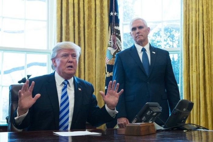US President Donald Trump, with Vice President Mike Pence (R) speaks from the Oval Office of the White House in Washington, DC, on March 24, 2017