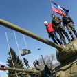 Pro-Russian activists stand on top of a tank outside a museum in Donetsk, Ukraine, in March 2014
