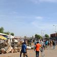 Residents gather near the scene of a suicide bomb attack on a market in Maiduguri, after two young girls blew themselves up, killing themselves and wounding at least 17 others, in December 2016