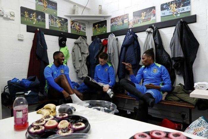 Sutton United players sit in the dressing room ahead of a team training session and media day at The Borough Sports Ground in Sutton, south-west London, on February 16, 2017