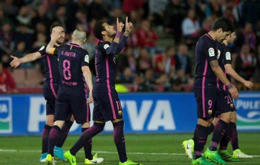 Barcelona's forward Neymar da Silva (C) celebrates after scoring in Granada on April 2, 2017