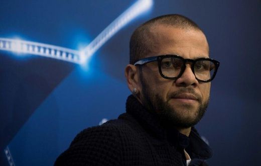 Juventus' Brazilian defender Dani Alves looks on before a press conference at the Sanchez Pizjuan's stadium in Sevilla on November 21, 2016 on the eve of the UEFA Champions League football match Sevilla FC vs Juventus