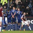 Burnley's Irish midfielder Robbie Brady (L) scores his side's equaliser against Chelsea from a free-kick during the English Premier League match at Turf Moor in Burnley, north-west England on February 12, 2017