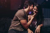 Young couple enjoying in the party at pub