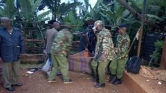 Police carry away a dead body during a past incident (Twitter)