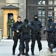 Police stand outside Stockholm Castle after a truck crashed into the Ahlens department store at Drottninggatan in central Stockholm, April 7, 2017