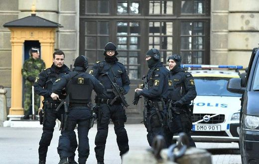 Police stand outside Stockholm Castle after a truck crashed into the Ahlens department store at Drottninggatan in central Stockholm, April 7, 2017