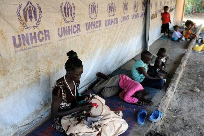 South Sudanese refugees wait outside their tent in Kakuma refugee camp, northwestern Kenya, on September 6, 2010
