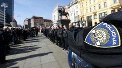 A police officer stands by as supporters of a Croatian far-right party gather in Ban Jelacic Square in downtown Zagreb on February 26, 2017