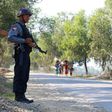An armed Myanmar police officer is posted on the road during the arrival of the UN special rapporteur on Myanmar in Buthidaung, northern Rakhine State on January 14, 2017