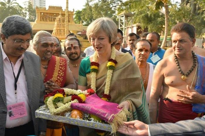Britain's Prime Minister, Theresa May (R) is on a charm ofensive in Bangalore, India's tech on November 8, 2016