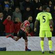 Southampton's Nathan Redmond (L) celebrates his goal during their League Cup semi-final first leg against Liverpool at St Mary's Stadium in Southampton, southern England on January 11, 2017