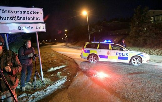 Journalists work at a police checkpoint in Marsta, north Stockholm, on April 7, 2017 after a man suspected of being involved in the truck attack in central Stockholm was arrested