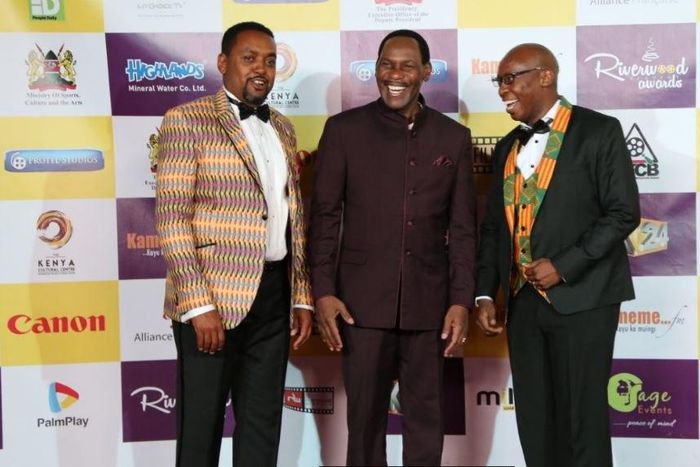 Host of the night Mwaniki Mageria, CEO of Kenya Films Classification Board Ezekiel Mutua and Kangethe Mungai of Riverwoods Ensemble at the red carpet.