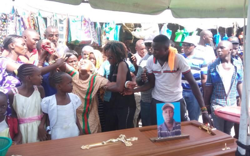 Nancy Muthoni, wife to deceased man Anthony Kioko comforted after husband's body was dumped in Likoni Ferry Channel (The Standard)