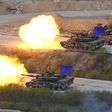 South Korean K1A2 tanks fire live rounds during a joint live firing drill between South Korea and the US at the Seungjin Fire Training Field in Pocheon on April 26, 2017