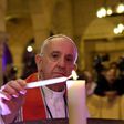 Pope Francis lights a candle at the Saint Peter and Saint Paul church in Cairo, where 29 people died in a December suicide bombing