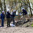 OSCE monitors work near Lugansk on April 25, 2017, to inspect the site where an OSCE patrol vehicle was destroyed by an explosion on April 23