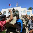 Tunisian protesters gather outside the Tataouine governor's office on May 22, 2017, in solidarity with a sit-in outside an oil and gas installation in the same province to demand jobs
