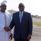 Senegal's President Macky Sall (R) shakes hands with the new President of Gambia Adama Barrow prior to leaving the Senegalese capital Dakar on January 26, 2017