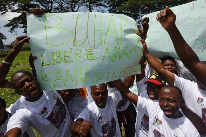 Demonstrators from the Indigenous People of Biafra (IPOB) hold a sign reading "Buhari, free Nnamdi Kanu from prison" during a protest in the Abidjan suburb of Treichville on September 23, 2016 calling for the release of the pro-Biafra leader
