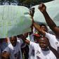 Demonstrators from the Indigenous People of Biafra (IPOB) hold a sign reading "Buhari, free Nnamdi Kanu from prison" during a protest in the Abidjan suburb of Treichville on September 23, 2016 calling for the release of the pro-Biafra leader