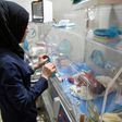 This file picture shows a Syrian nurse standing next to incubators with newborns at a children's hospital on June 9, 2016