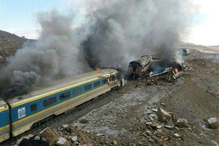 Smoke billows from destroyed train carriages following an accident in Semnan province, some 250 kms east of the Iranian capital Tehran, on November 25, 2016