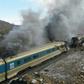Smoke billows from destroyed train carriages following an accident in Semnan province, some 250 kms east of the Iranian capital Tehran, on November 25, 2016