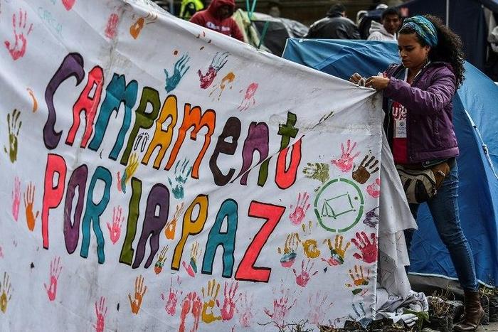 A tent sign reading "Camping for peace" during a demonstration to push for immediate implementation of a peace accord between the Colombian government and FARC guerrillas