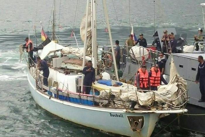 Philippine navy personnel stand onboard the yatch Rockall, where the body of a naked white woman who had been shot was found was aboard, after it was recovered off Laparan island, in Sulu province