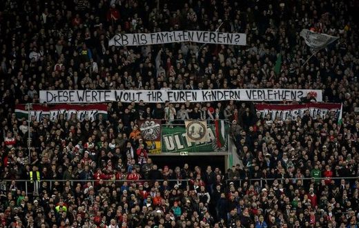 Augsburg fans hold up anti-Leipzig banners -- detractors of the Red Bull-owned team are now in a small minority
