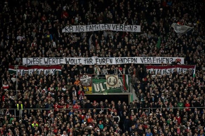 Augsburg fans hold up anti-Leipzig banners -- detractors of the Red Bull-owned team are now in a small minority