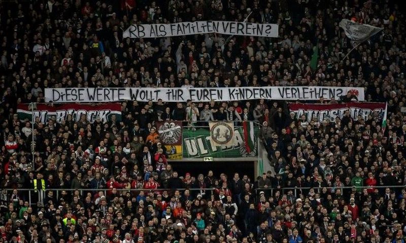 Augsburg fans hold up anti-Leipzig banners -- detractors of the Red Bull-owned team are now in a small minority