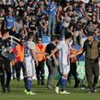 A Bastia's official (C-R) argues with Lyon's Brazilian defender Rafael da Silva (C-L) during scuffles at half-time between some of Lyon's players and Bastia's officials, during the French L1 football match Bastia vs Lyon on April 16, 2017
