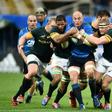 Italy's Sergio Parisse (centre) is tackled by South Africa's players during their rugby union Test match in Florence on November 19, 2016