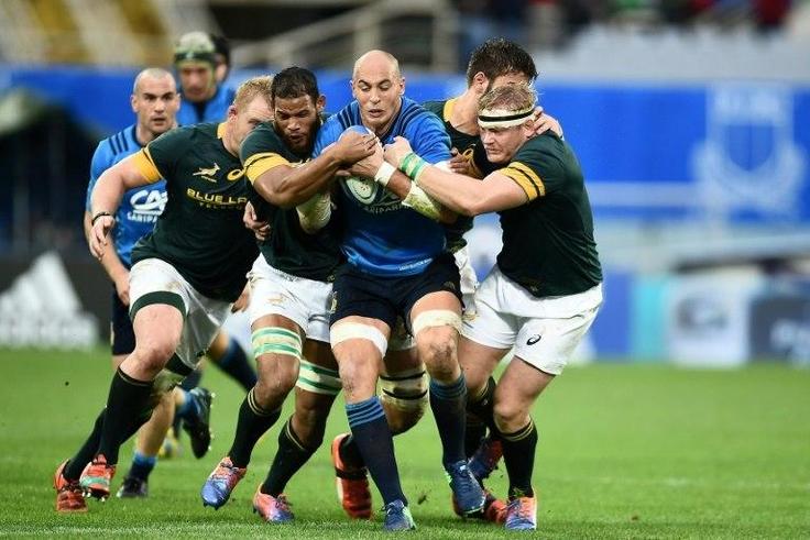 Italy's Sergio Parisse (centre) is tackled by South Africa's players during their rugby union Test match in Florence on November 19, 2016