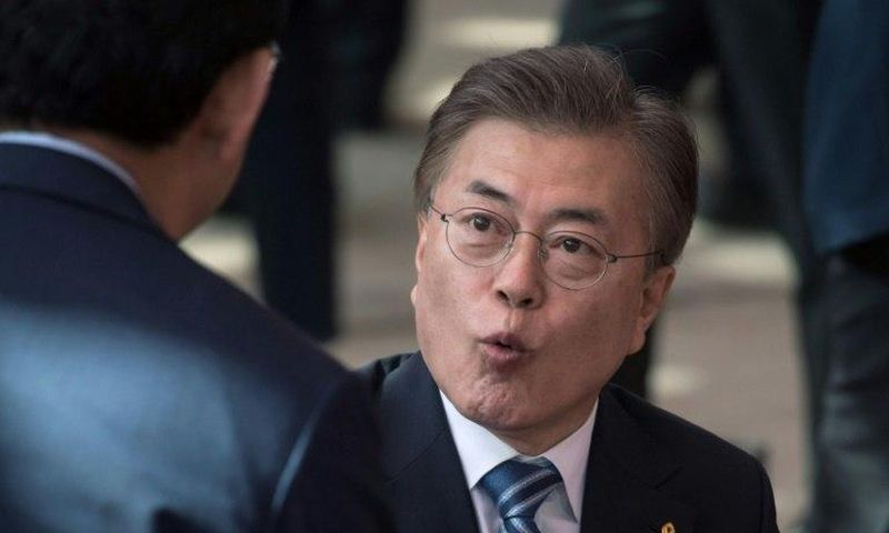 South Korea presidential candidate Moon Jae-In attends a prayer session marking Buddha's birthday on May 3, 2017