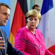 German Chancellor Angela Merkel and French President Emmanuel Macron say they are ready to change EU treaties if necessary