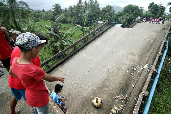 A bridge linking the city of Surigao to nearby towns, damaged after a 6.5-magnitude earthquake struck overnight on the southern Philippine island of Mindanao, on February 11, 2017