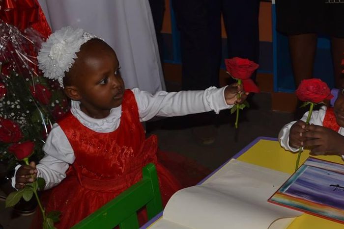 Formerly Conjoined twins babies Blessing and Favor exchange rose flowers at the Kenyatta National  Hospital.