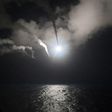 Image released by the US Navy shows the USS Porter launching cruise missiles at a Syrian airbase from the Mediterranean