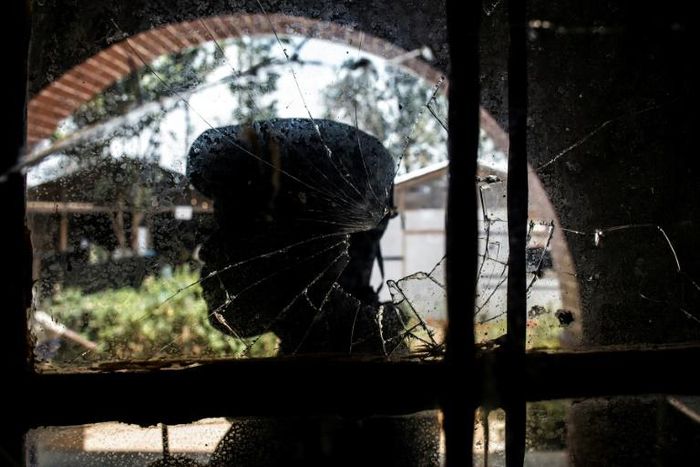 A bullet-shattered window at an Ebola treatment centre in Butembo after it came under attack on March 9. A policeman was killed and a health worker wounded