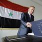 A Syrian civil servant in the Idlib administration checks a register at his temporary base in Hama on March 13, 2017