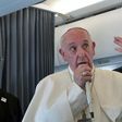 Pope Francis addresses reporters during his flight back to Rome following a two-day visit at Fatima in Portugal