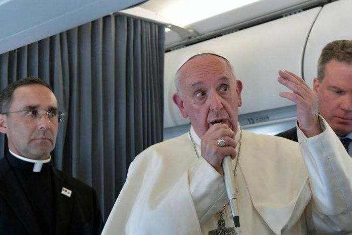 Pope Francis addresses reporters during his flight back to Rome following a two-day visit at Fatima in Portugal